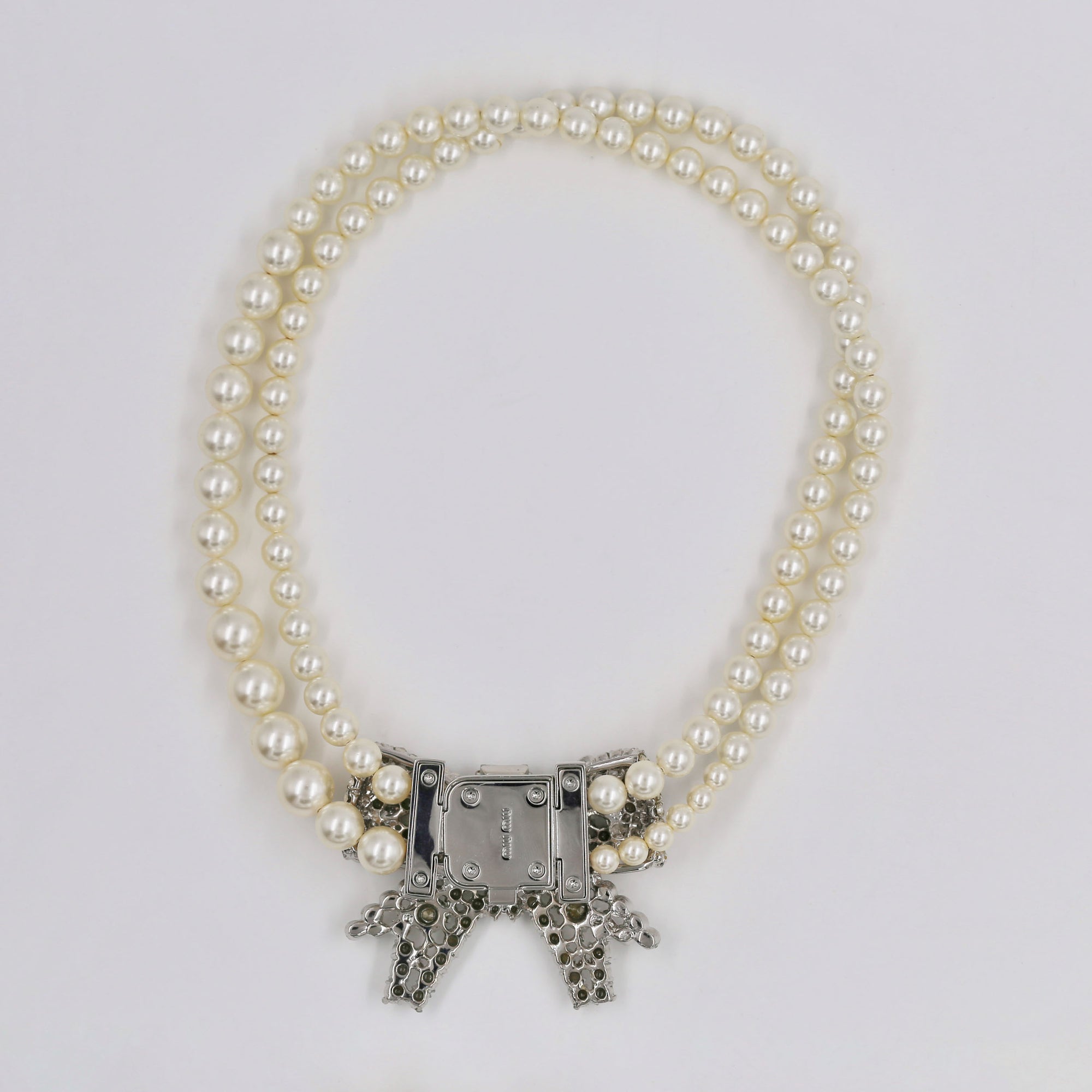 Miu Miu shiny bow and pearly necklace