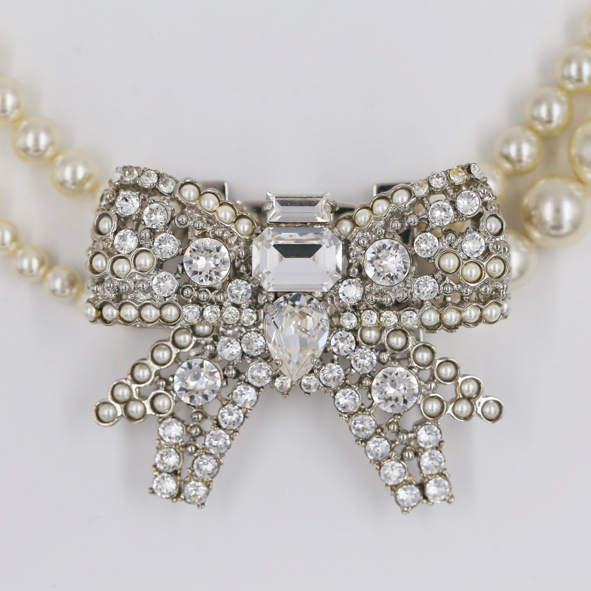 Miu Miu shiny bow and pearly necklace