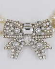 Miu Miu shiny bow and pearly necklace