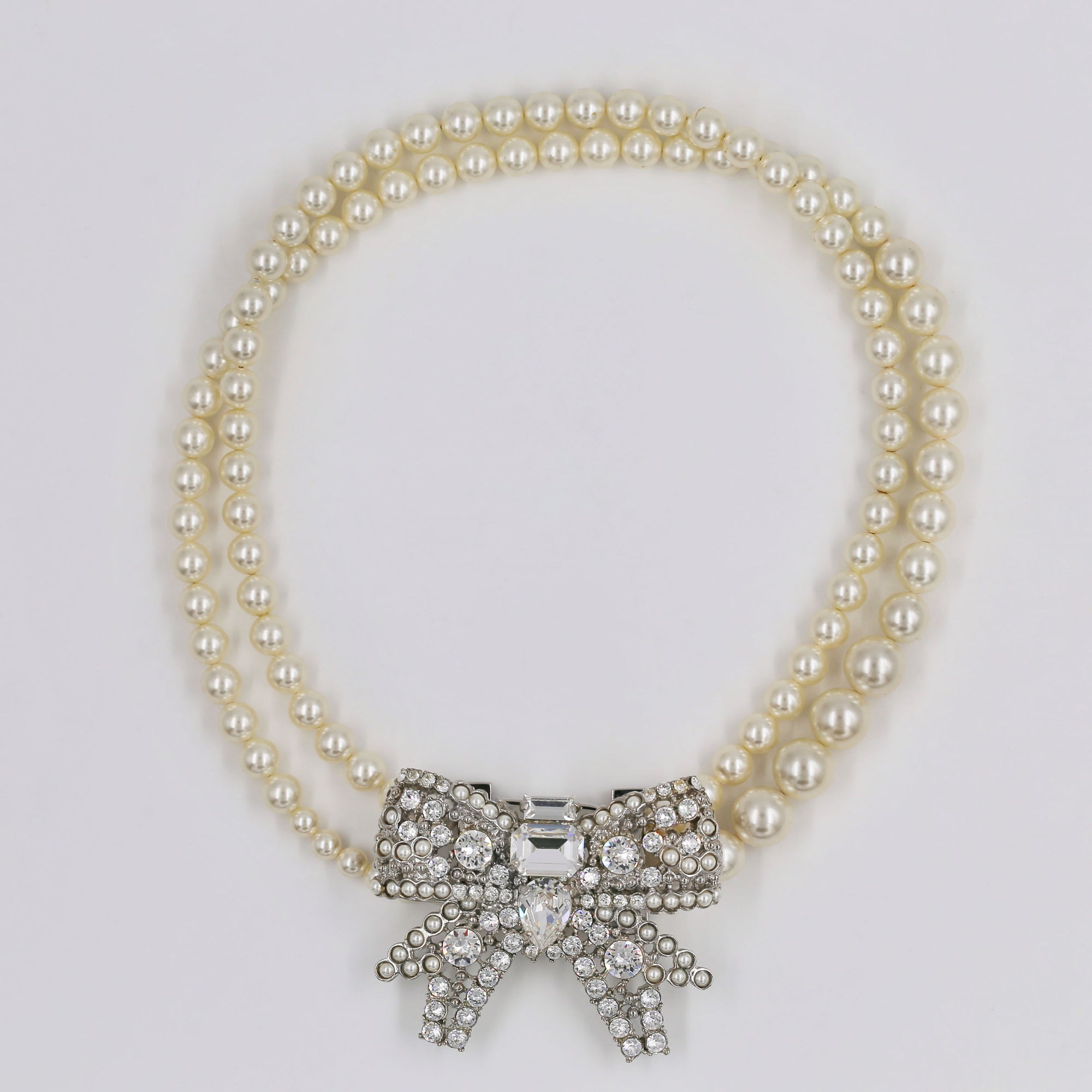 Miu Miu shiny bow and pearly necklace