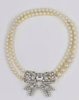 Miu Miu shiny bow and pearly necklace