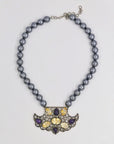Elegant pearl necklace with a shiny pendant