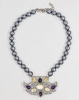 Elegant pearl necklace with a shiny pendant