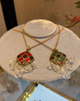Up-cycled skull red and green pendant with chain