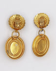 Oversize golden and green clips