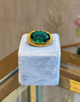 Small green and golden oval brooch