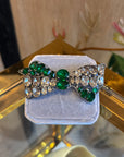 Shiny green bow brooch