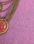 Gold-plated multi-layered necklace with a coral pendant
