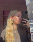 Oversize golden and green clips