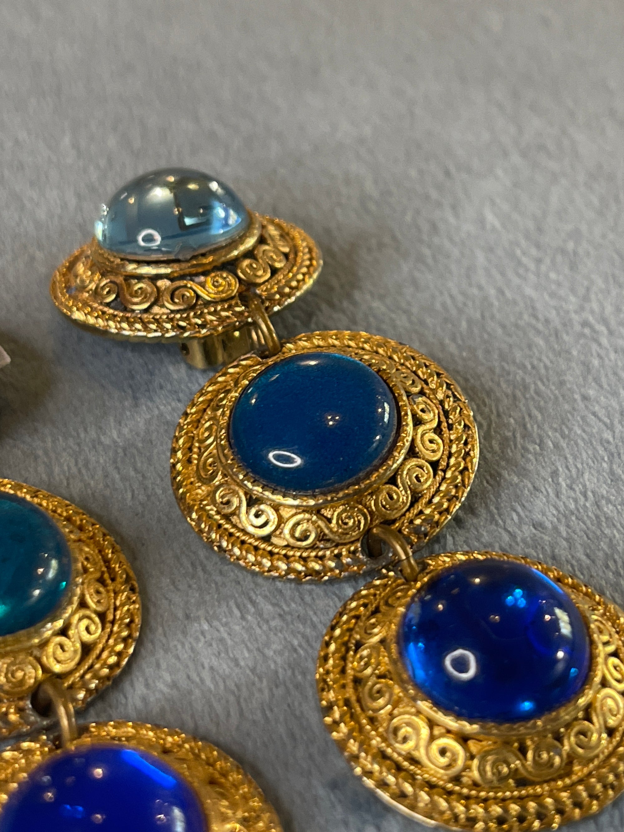 Golden blue round dangly clips 250