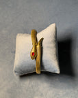 1950s French Gold-Plated Snake Bracelet with Red Glass