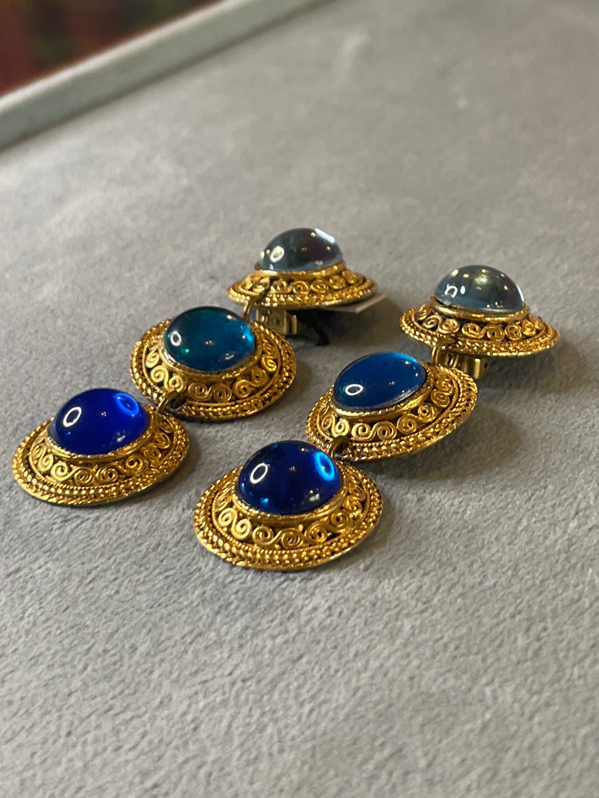Golden blue round dangly clips 250