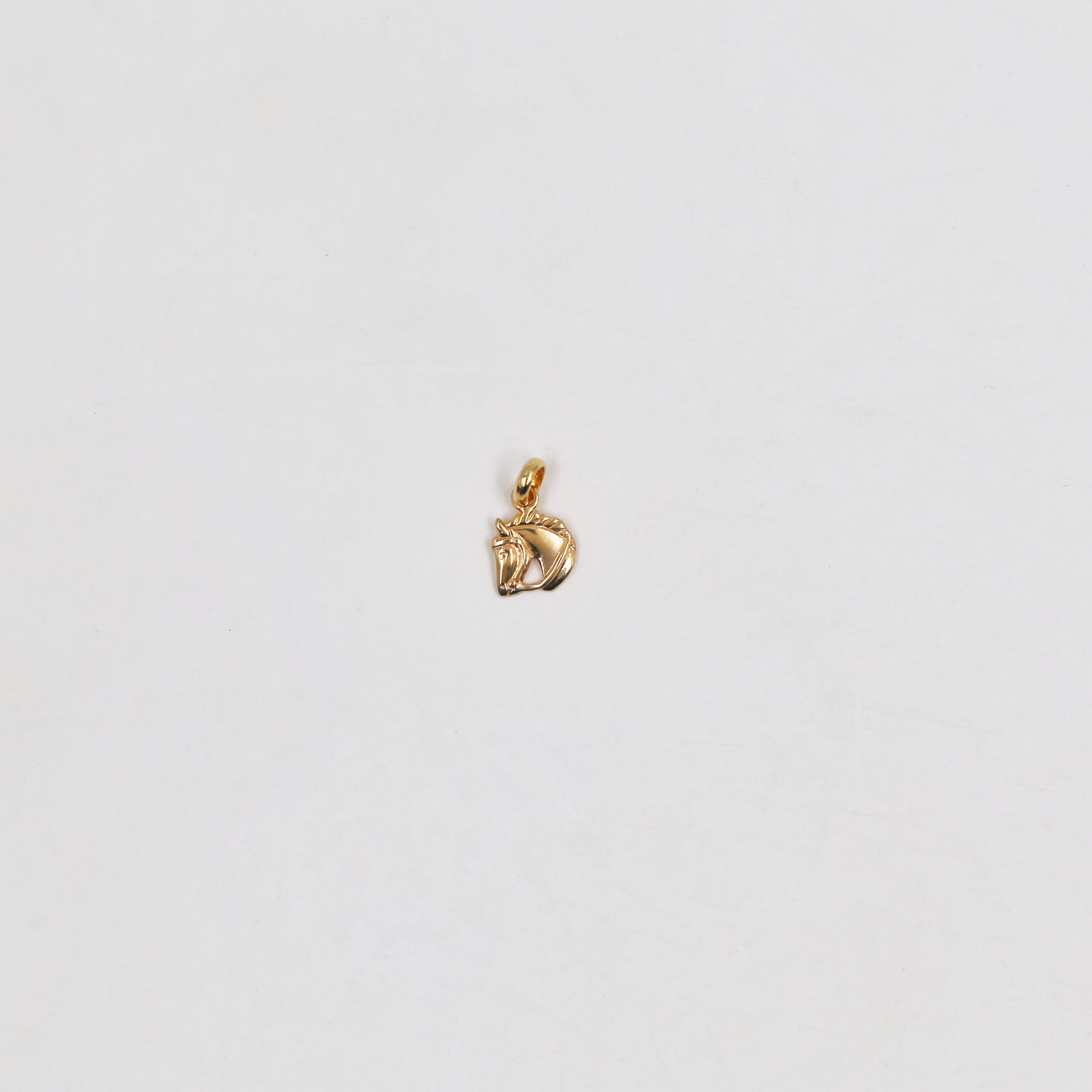 Playful gold-plated pendant (and gift chain)