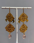 Openwork golden and pink dangly earrings