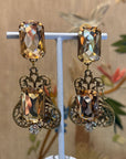 Maximalist orange openwork dangly clips