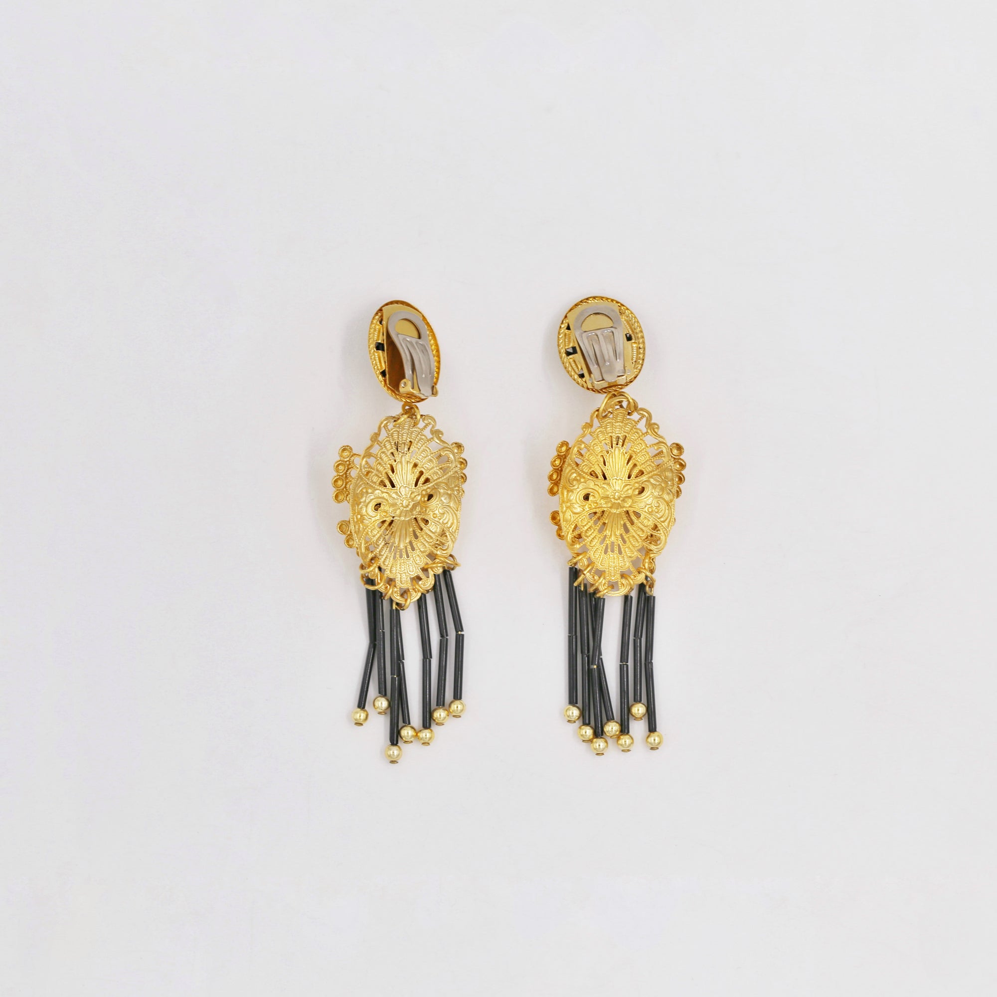 Dangly golden black and white clips