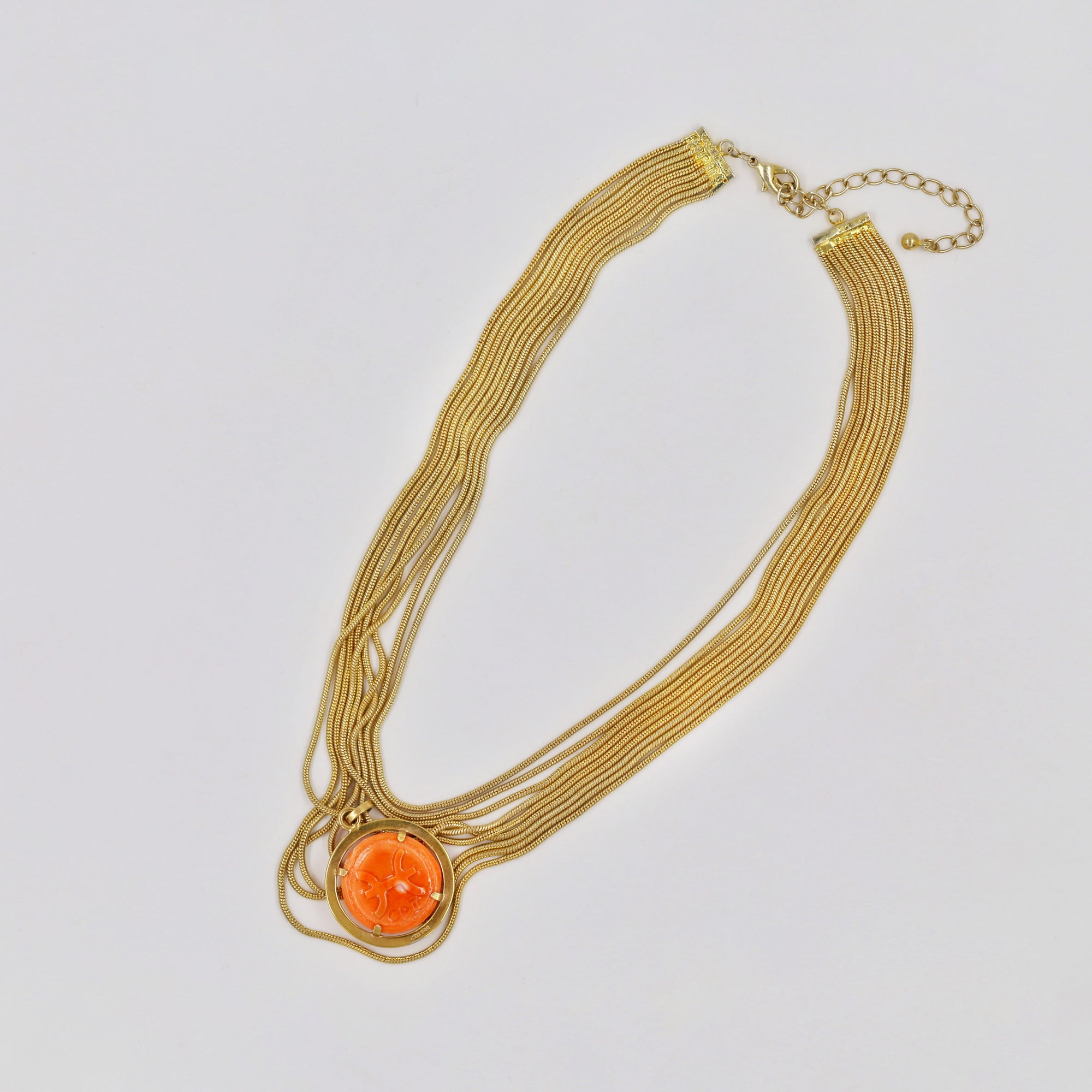 Gold-plated multi-layered necklace with a coral pendant