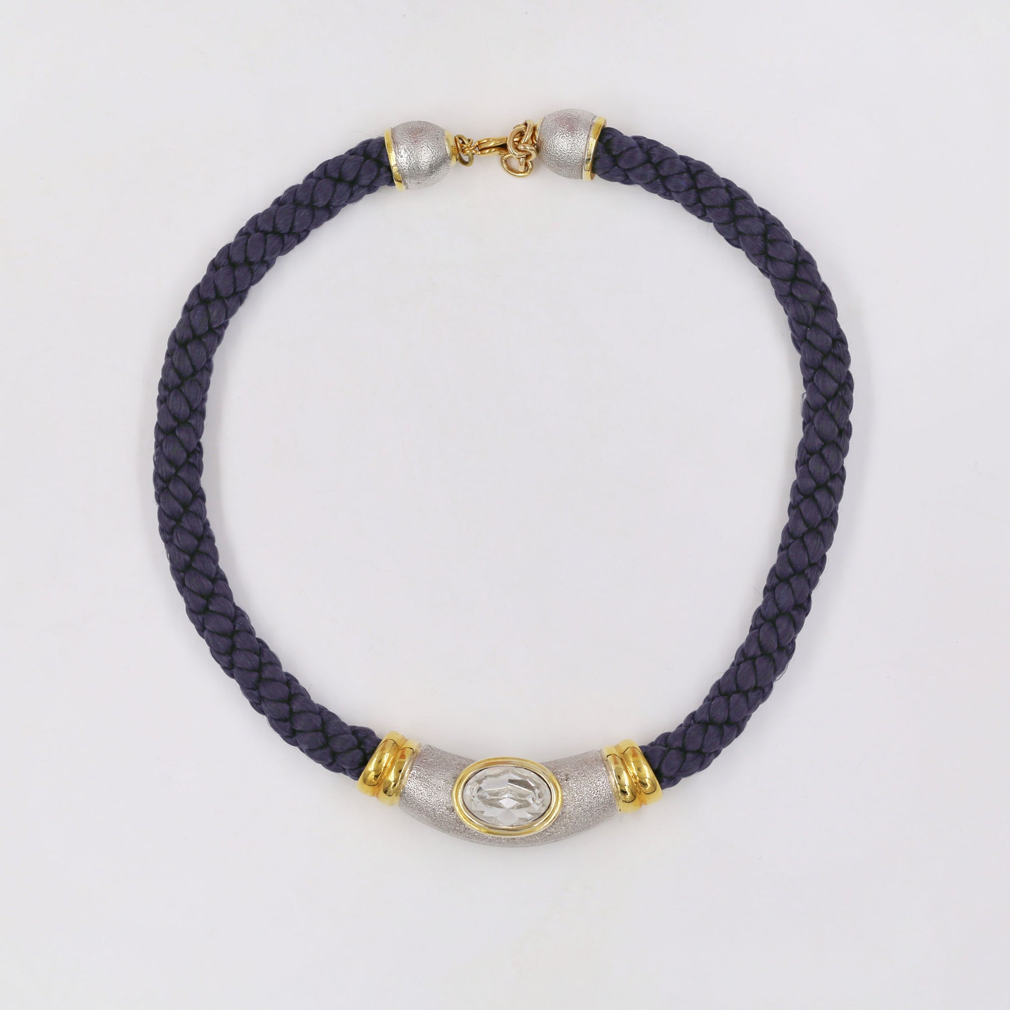 Braided blue necklace with golden and silvery pendant