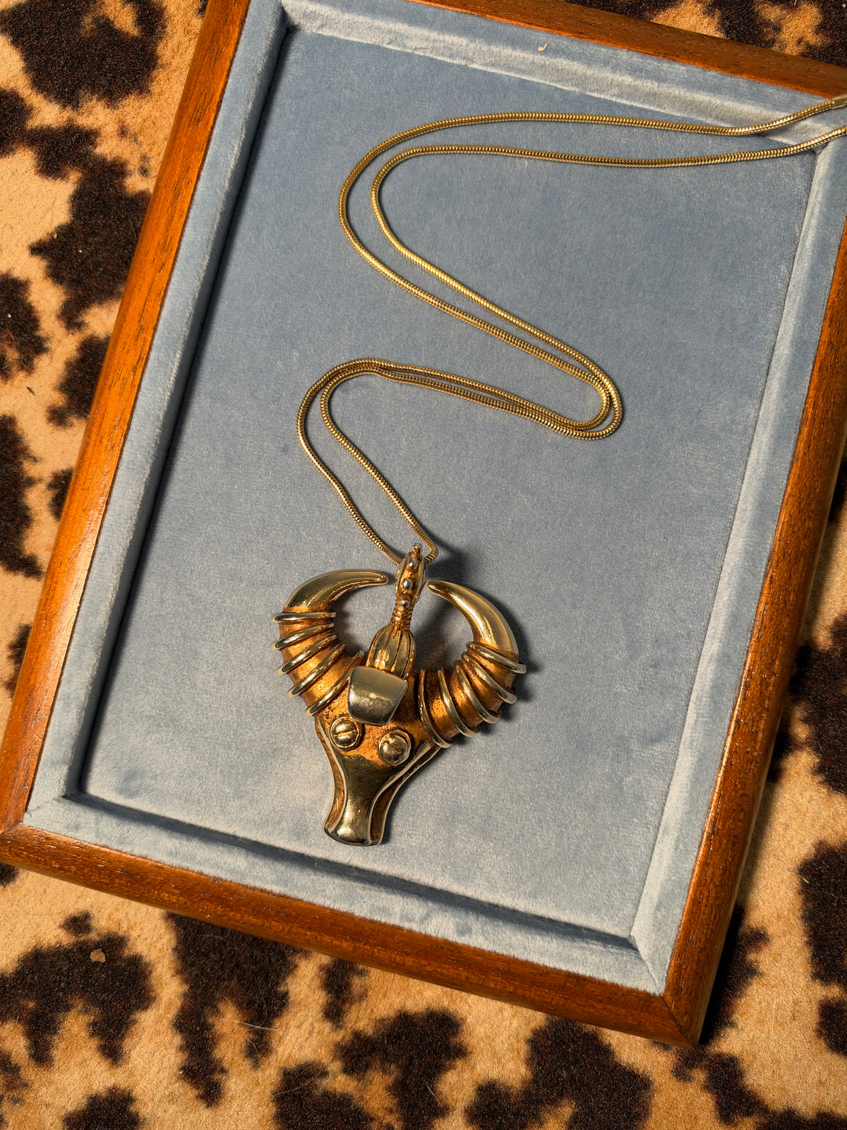Golden taurus face necklace