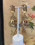 Maximalist orange openwork dangly clips