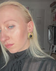 Amazing mat golden earrings with black resin