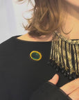 Small green and golden oval brooch