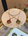 Up-cycled skull red and green pendant with chain