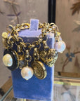 Bold golden bracelet with charms
