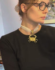 Golden crab pendant