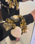 Bold golden bracelet with charms