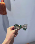 Shiny green bow brooch