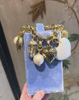 Bold golden bracelet with charms